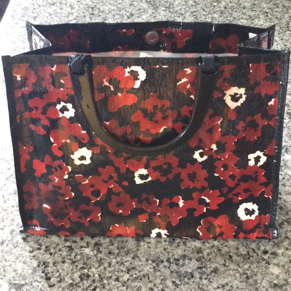 Blue Q handbag with plastic handle.